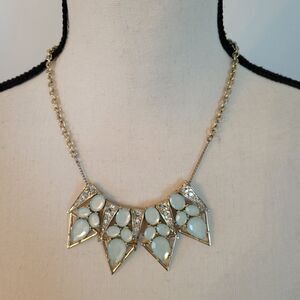 Pointed arrow light blue stones and white saphire stones on gold tone necklace